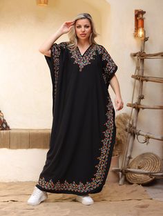 An elegant and stylish caftan will make you feel like African royalty. It's extremely elegant with a dash of colorful cotton embroidery adorning the kaftan. Ideal for plus size women as well. Made of extremely soft fabric to make you feel free and beautiful at the same time.  This Kaftan is ideal to wear for any casual occasion. Whether taking a trip down the shopping lane, or home-based kitty parties, or about anything else, wearing this dress will make you feel classy and comfortable. Fabric : Summer V-neck Embroidered Abaya, Summer Embroidered V-neck Abaya, Beach Abaya Free Size, Black Bohemian Style Thobe, Embroidered Free Size Kaftan For Vacation, Tunic Abaya For Eid Vacation, Bohemian Embroidered Abaya For Vacation, Embroidered Tunic Abaya For Vacation, Maxi Length Abaya As Beach Cover-up