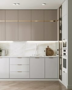 a modern kitchen with white cabinets and marble counter tops