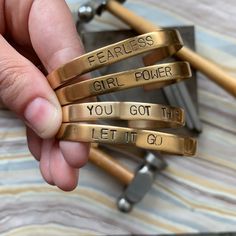 Are you all about strength and encouragement? Here are a few of our favorite strong mantras OR you can get custom with your cuff. Just email or call us, or see the product HERE: Custom Cuffs! Not sure what mantra to choose? Visit the "Hand Stamped" section of our site to browse other popular mantras for inspiration! Cuffs are 3/8" wide on the surface Available in Brass, Copper, and Sterling Silver Choose from 2 font options: Typewriter or Large Block Handcrafted in Little Rock, Arkansas Our imag Silver Font, Silver Spoon Jewelry, Little Rock Arkansas, Spoon Jewelry, Bead Bangles, Hand Stamped Jewelry