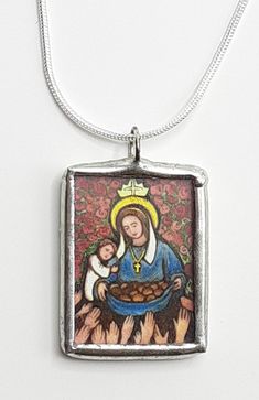 "This charm/pendant portrays St Elizabeth of Hungary. She was born in 1207 in Thuringia into royalty. She was married at 14 and widowed at 20, after having borne 3 children. She was much attracted from an early age to a life of piety and self renunciation so when she was released from her queenly duties at age 20, she arranged for the care of her children and became a Third Order Franciscan. She founded a hospital to care for the poor and needy and died at age 24. Much beloved by all who knew he Handmade Pendant Necklace For Commemoration, Amulet Pendant Necklace For Commemoration, St Elizabeth Of Hungary, Virgin Mary Pendant Jewelry As A Gift, Elizabeth Of Hungary, Saint Elizabeth Of Hungary, Our Lady Of The Miraculous Medal, Virgin Mary Pendant Necklace As Gift, Virgin Mary Pendant Jewelry Gift