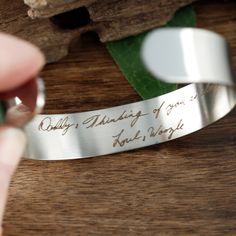 "Actual Handwriting Bracelet, Custom Engraved Cuff Bracelet, Personalized Gift for Mom. Mother of the Bride, Handwriting Jewelry, Gold Cuff ANY handwriting can be on the outside &/or inside of this CUFF. Transform your handwriting into a beautiful keepsake. For your Daughter, Wife, Friend, Mom. This is laser engraved into high quality heavy gauge Aluminum. Cuff Measures 6\" x 1/2\" up to 2 lines can be engraved How to order: 1. Add this item to your shopping cart 2. Select Side to Engrave on Engraved Cuff Bracelets For Anniversary, Inspirational Engraved Bangle Bracelets, Inspirational Engraved Bangle Bracelet, Meaningful Engraved Cuff Bracelet As Gift, Personalized Engraved Bangle, Adjustable Engraving Option Cuff Bracelet, Adjustable Cuff Bracelet With Engraving Option, Engraved Cuff Bracelet As Gift, Engraved Cuff Bracelet Gift