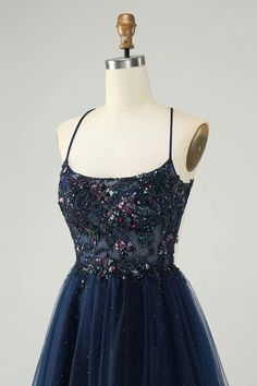 Glitter Navy A-Line Sequined Tulle Homecoming Dress Sequined Glitter Tulle Evening Dress For Parties, Party Evening Dress In Glitter Tulle With Sequins, Party Evening Dress With Sequins And Glitter Tulle, Sleeveless Embellished Dress With Glitter Tulle, Elegant Homecoming Dress In Glitter Tulle, Glitter Tulle Dress For Prom Season, Fitted Embellished Glitter Tulle Dresses, Sleeveless Sequin Dress With Glitter Tulle, Blue Glitter Tulle Dress For Prom Season