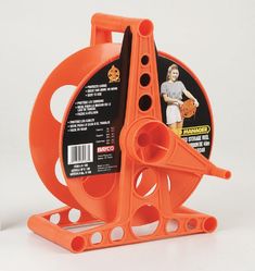 an orange plastic reel holder on a white background