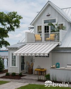 a white house with an awning over it