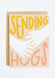 a card with the words sending hugs written on it and hands coming out from underneath