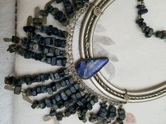 Vintage Peruvian Lapis Silver Bib Style Necklace,, lovely craftsmanship.. each stone is linked with silver wire and a nice Lapis stone inlaid in silver ornate metal is the center pieces.. shorter style necklace.. 15 inches Silver Wire Wrapped Bohemian Necklaces, Silver Wire Wrapped Bohemian Necklace, Silver Beaded Necklaces With Natural Stones, Silver Gemstone Necklace For Festival, Festival Silver Jewelry With Stones, Bohemian Metal Necklaces With Stones, Bohemian Sterling Silver Stone Necklaces, Silver Bohemian Beaded Necklace With Natural Stones, Bohemian Silver Beaded Gemstone Necklace