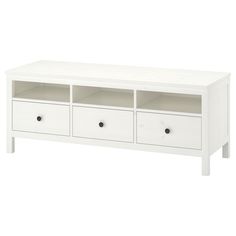 a white entertainment center with drawers on each side