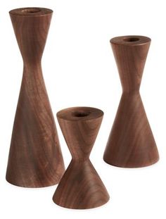 three wooden vases sitting next to each other