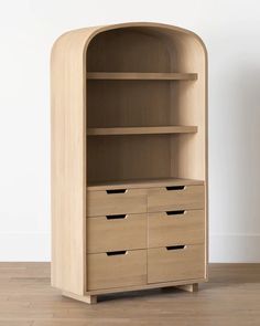 a wooden bookcase with drawers on the bottom and one drawer open to reveal something