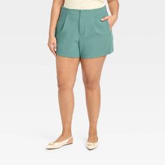 Create an array of cool and confident warm-weather looks with these High-Rise Tailored Shorts from A New Day™. Made from lightweight fabric with a hint of spandex, these high-rise shorts offer all-day cool comfort and easy movement. Designed with a fly hook and zipper, they feature two side pockets to add functional flair to your look, while the solid hue makes for easy pairing with different tops. A New Day™: Style that goes wherever you do.