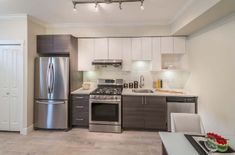 the kitchen is clean and ready for us to use in this apartment's new model home