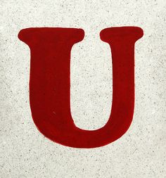 the letter u is painted red and white