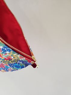 "100% Cotton. Lightweight. From the world famous Liberty Fabrics with a silk-like touch, unique print quality and striking color vibrancy. This pouch is great size for a couple of small items. Size is 7.75\"W / 6.25\"H (20cm / 15.5cm) Fabric is Liberty of London Tana Lawn. The pouch opens with golden color zipper.(High quality YKK zipper) It comes with a velvet ribbon on one side. Lined inside with red color cotton. Please, Hand wash. Or cool brilliantly on a machine hand wash. All my works are Red Cosmetic Bag With Zipper Closure - Gift, Multicolor Pouch Cosmetic Bag As Gift, Red Cosmetic Bag With Zipper, Red Zipper Cosmetic Bag, Multicolor Zipper Pouch As A Gift, Multicolor Zipper Pouch Clutch As Gift, Multicolor Cosmetic Bag With Zipper Closure As Gift, Pouch Clutch With Zipper Closure Gift, Gift Cosmetic Clutch Bag With Zipper Closure