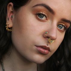 Beautiful 2-micron gold plating over sterling silver nose stud set with turquoise/green onyx and a little ball charm. 20 Gauge - 0.8mm Stone size: 3mm / 0.11'' total diameter:5mm / 0.19'' This listing is for a SINGLE nose stud. For more gold nose studs, click the link below: https://www.etsy.com/il-en/shop/RONIBIZA?ref=listing-shop2-all-items-count&search_query=gold+nose+stud For more nose studs, click the link below: https://www.etsy.com/il-en/shop/RONIBIZA?section_id=14762261 Back to my sh Nostril Stud, Piercing Nostril, Tiny Nose Studs, Tiny Nose, Nose Piercing Stud, Fake Gauge Earrings, Gold Nose Stud, Nose Earrings, Nose Piercing Jewelry