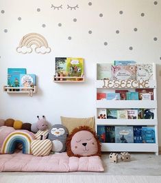 a child's room with bookshelves and toys