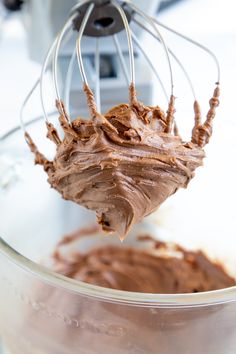 chocolate frosting being made in a mixer