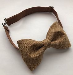 Vintage Tan PU leather suspenders 1/2” wide and bow tie set.Size 6m-2yo years old suspenders are 29"long. Bow tie measures 3 1/2x2", neck strap is 14 1/2" long.Size 3-6 years old suspenders are 33" long.  Bow tie measures 4x2 1/4", neck strap is 15 1/2" long.Size 7-11 years old suspenders are 37" long. Bow tie measures 4 1/2x2 1/2", neck strap is 16 1/2" long.Size adult suspenders are 55" long.  Bow tie measures 5x 2 3/4", neck strap is 24" long.Please allow me 2-3 days to make your ties as I do Long Bow, Leather Suspenders, Burlap Bow, Wedding Order, Bow Tie Set, Burlap Bows, Burlap Fabric, Tie Set, Neck Strap