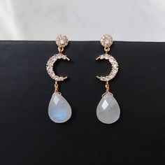 Bedazzle everyone with this flashy Rainbow Moonstones earrings! Great as a gift for weddings, birthdays, anniversary or even for yourself. Handmade with Natural Rainbow Moonstones and 14K Gold Plated Cubic Zirconia Crescent Moon connector with 925 Silver Vermeil studs. Nickel free, suitable for sensitive skin. Get a matching necklace at below link: http://www.icingonrocks.etsy.com/listing/1314375345 Measurements --------------------- Main stone dimensions (height x width):  1.6 x 1.2 cm / 0.63 x Elegant Moon-shaped Earrings For Gift, Elegant Moon-shaped Jewelry With Matching Earrings, Elegant Moon-shaped Wedding Earrings, Elegant Moon Shaped Wedding Earrings, Elegant Moon Charm Drop Earrings, Elegant Moon-shaped Party Jewelry, Elegant Moon Charm Earrings As Gift, Elegant White Moon Charm Earrings, Elegant Earrings With Moon Charm For Gifts