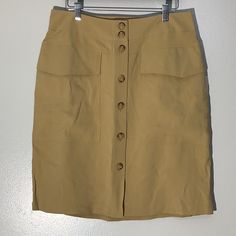 A New Day Tan High Rise Button Down Skirt With Pockets On Both Sides 93% Rayon 7% Polyester Size 12 Workwear Mini Skirt With Button Closure, Knee-length Office Skirt With Button Closure, Office Knee-length Skirt With Button Closure, Knee-length Pencil Skirt For Workwear, Knee-length Pencil Skirt With Button Closure For Work, Beige Relaxed Skirt With Button Closure, Buttoned Pencil Mini Skirt For Work, Pencil Mini Skirt With Buttons For Workwear, High Waist Buttoned Pencil Skirt For Work