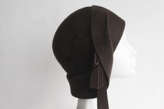 Cloche Hat. Chocolate brown fur felt cloche hat, in a super soft texture by And They Loved Hats. Beautifully designed using 1920's millinery techniques to create that nostalgic Art Deco elegance. Designed with wide contoured front brim, short fold back collar brim and  embellished with chic trailing petersham ribbon. This exquisite hat is perfect for afternoon teas, evening events and winter gatherings. Available in bespoke felt/ribbon colourways to coordinate with your outfit. Made to order. Ma Brown Fur Felt Cloche Hat, Brown Cloche Felt Hat For Winter, Fitted Cloche Hat With Curved Brim, Fitted Cloche Winter Hat, Winter Fitted Cloche Hat, Winter Fur Felt Cloche Hat, Solid Winter Cloche Felt Hat, Winter Felt Cloche Hat, Vintage Solid Felt Hat For Winter