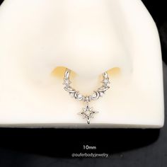 a close up of a necklace on a mannequin's head with diamonds