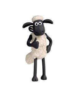 a black and white sheep standing on its hind legs