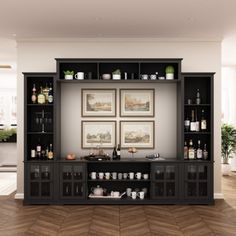 an entertainment center with black cabinets and pictures on the wall