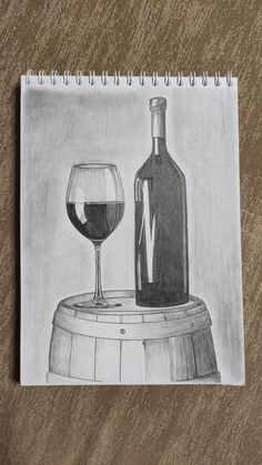 a drawing of a wine glass next to a bottle on top of a wooden barrel