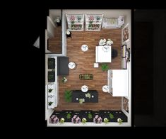 an overhead view of a living room and dining area in a small apartment with wood flooring