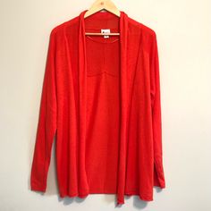 Deep Coral-Red, Long-Sleeve Flyaway Cardigan With Ribbed Knit Sleeves And Across Shoulders, With A Rolled Hem. Size: Large Condition: Pre-Owned, With Tags Approximate Measurements: *Pit To Pit: 20" *Length: 29" Red Open Front Tops For Winter, Red Open Front Top For Winter, Red Open Front Spring Sweater, Casual Red Cardigan For Layering, Red Open Front Sweater For Spring, Red Long Sleeve Cardigan For Layering, Casual Red Open Front Top, Red Open Front Layering Cardigan, Red Open Front Cardigan For Layering