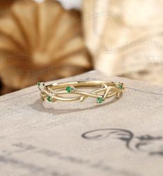 Tiny Emerald Wedding Band, Dainty Emerald Ring, Vine Leaf Wedding Ring, Twig Ring Yellow Gold, Delicate Stacking Ring, Anniversary Ring  Ring#:NC1028 Stones: Natural emerald size/weight:0.04ct Custom orders are most welcome! Please feel free to ask for any item, any adjustments or anything else you want me to make. Rush order Orders can be expedited for a fee. If your order needs to be expedited, please contact us ASAP. Layaway plan We offer layaway plan that works with a $100 as the first payme Leaf Wedding Ring, Delicate Stacking Rings, Leaf Wedding Rings, Emerald Wedding Band, Smaragd Ring, Vine Ring, Twig Ring, Emerald Wedding, Unique Wedding Bands