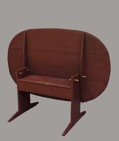 a wooden chair with a seat made out of wood and brown leather on the back