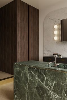 a green marble counter top in a bathroom