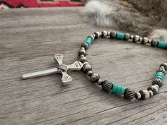 Simple yet powerful, a true labor of love! ~ Limited Quantity ~~ This awesome cross was made by an artist from vintage nails, sand-cast in white bronze sterling silver, hand stamped, and wire wrapped! ~Graced with a Lovely Strand of Navajo Handmade Pearls with Pumpkin Beads and turquoise Handmade by Navajo Artists exclusively for Navajo Pearls Ranch!~Choose Your Length ~Each bead is heavily plated in .925 sterling silver, hand polished & antiqued, creating a perfect handmade Navajo Pearl.You won Pumpkin Beads, Pumpkin Bead, Vintage Nails, Navajo Pearls, Handmade Pendant Necklace, Navajo Style, Pendant Necklace Simple, Turquoise Cross, Sand Casting