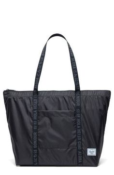 A versatile tote that's lightweight and packable is perfect as an additional travel bag and features a trolley strap to set atop your main roller luggage. Top zip closure Top carry handles Exterior front zip pocket Internal hanging pocket doubles as a self-storage pouch Snap-down loop for easy hanging Trolley strap Recycled polyurethane Imported Black Foldable Shoulder Bag For Travel, Casual Nylon Packable Travel Bag, Foldable Nylon Travel Bag For Everyday Use, Casual Black Nylon Luggage, Black Foldable Travel Bag For Everyday Use, Functional Lightweight Nylon Bags, Lightweight Functional Nylon Bags, Casual Black Foldable Bag, Black Nylon Travel Accessories With Large Capacity