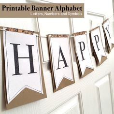 a happy birthday banner hanging on a door with the words happy written in black and white