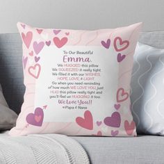 a pink pillow with hearts on it and the words to our beautiful emma written in cursive writing