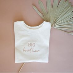 Embroidered Big Brother Shirt, Toddler Tshirt, Toddler Crewneck, Custom Embroidered Toddler Tshirt, Neutral Toddler Shirt, Big Brother Announcement Shirts are embroidered with a sand colored thread and made on industrial embroidery machines. T-shirts run true to size and are a cream/neutral color They make for a perfect pregnancy announcement or gift. The inside of the t-shirt has soft backing to make it comfortable to wear. These are made upon ordering. Embroidered Cotton Crew T-shirt, Embroidered Cotton Crew Top, Relaxed Fit Crew T-shirt With Custom Embroidery, Custom Embroidered Relaxed Fit Crew T-shirt, Crew Neck T-shirt With Custom Embroidery, Cotton Crew Top With Embroidered Text, Cotton Crew T-shirt With Embroidered Text, Embroidered Cotton Short Sleeve Sweatshirt, Crew Cotton Top With Machine Embroidery