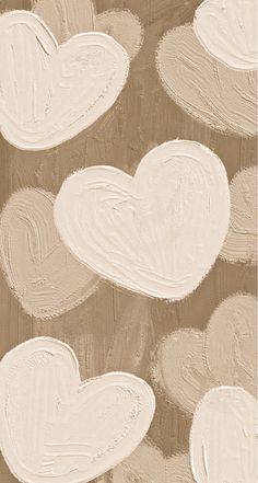 some white hearts are on a brown background