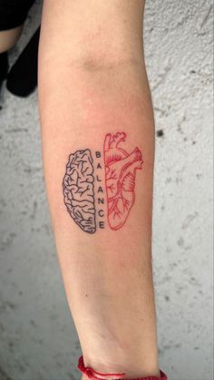 a person with a tattoo on their arm that has two sections of the brain and heart