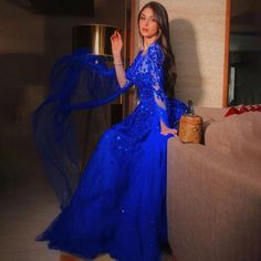 Blue Arabic Dubai Evening Dress 2024 with Cape Sleeves, Beaded Luxury - Ideal for Women's Formal Wedding Party Luxury Sequin Evening Dress With Cape Sleeves, Luxury Blue Embellished Kaftan, Blue Evening Dress With Cape Sleeves, Arabic Luxury, Pre-draped Evening Maxi Dress With Cape Sleeves, Luxury Blue Maxi Dress With Cape Sleeves, Elegant Cape, Cape Sleeves, Women Formals