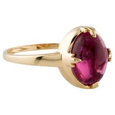 This elegant 14K Yellow Gold Cocktail Ring showcases a stunning 3.10 carat pink tourmaline cabochon, making it a perfect statement piece for any occasion. The smooth, oval-shaped tourmaline is set in a sleek and timeless design that highlights its natural beauty. Ideal for adding a pop of color and sophistication to your jewelry collection. Specifications: * SKU: SXNR-335 * Stock ID: RRING278490 * Metal Type: 14K Yellow Gold * Marks: 14K, Maker's Mark * Total Item Weight: 3.0 grams * Gemstone Details: * Center Stone: * Gemstone: Tourmaline * Carat Weight: 3.10 carats * Stone Count: 1 * Stone Shape: Cabochon, Oval * Stone Color: Pink * Type/Clarity: Slightly Included * Dimensions: * Band Width: 1.7mm * Ornament Length: 11.7mm * Ornament Width: 9.7mm * Ring Size: 7 (adjustable by one whole s Classic Pink Gemstones For Formal Occasions, Classic Oval Tourmaline Jewelry, Formal Cabochon Domed Ruby Ring, Formal Oval Cabochon Ruby Ring With Bezel Setting, Pink Round Cabochon Ruby Ring, Pink Cabochon Ruby Ring, Classic Tourmaline Jewelry With Polished Finish, Formal Tourmaline Ring With Bezel Setting, Formal Tourmaline Rings With Bezel Setting