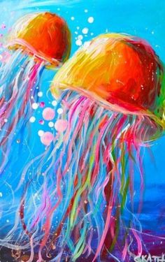 two jellyfishs with colorful hair floating in the blue water, one is orange and the other is pink