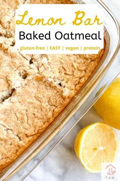 a lemon bar baked oatmeal in a glass baking dish next to sliced lemons