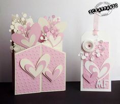 two valentine's day cards made from paper with hearts and flowers on the front