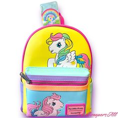 My Little Pony Has A Colorful Artwork Covers All Sides Of This Handy Backpack In Bold Blocks Of Yellow, Pink, Seafoam Green, Purple, And Blue. Fan-Favorite My Little Pony Characters Come To Life In Playful Prints. You Might Spot Starshine, Peachy, Applejack, Glory, Skydancer, Blossom, And Snuzzle. Pack Just What You Need For The Day To Take The Reins In Style. Features: Vegan Leather (Polyurethane) Padded, Adjustable Shoulder Straps Zippered Front Pocket For Securing Smaller Items Side Pockets S Cute Yellow Backpack For Back To School, Playful Yellow Bags For Back To School, Playful Yellow Backpack For Back To School, Playful Multicolor Standard Backpack, Cute Yellow Backpack Bag, Cute Yellow Travel Backpack, Playful Yellow Bag For Everyday Use, Yellow Backpack For Back To School With Zipper, Back To School Yellow Backpack With Zipper