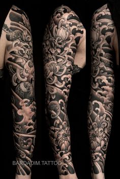 two men with full sleeves covered in black and white tattoos