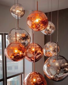 a bunch of glass balls hanging from a ceiling