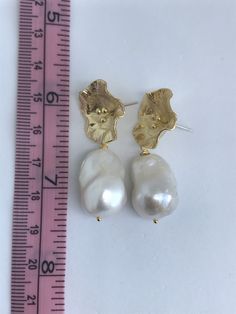 This is custom order, pearl shape and size will vary from images shown, but rest assured will be of same quality pearl and more or less same size. Feel free to request photos of baroque pearls to be used, if needed. This morning glory flower ear stud finding is large! The baroque pearls to be used used are AAAAA quality, white, lustrous, measures 15mm to 17mm x 20mm to 22mm. The flower ear stud finding is large, measures 19mm in diameter, gold plated over brass body with sterling silver ear post Gold Bridal Earrings With Pearl Drop In Flower Shape, White Baroque Pearl Bridal Earrings, White Baroque Pearl Bridal Earrings For Wedding, Baroque Earrings For Wedding, White Baroque Pearl Earrings For Party, Baroque Pearl Earrings For Wedding, Pearl White Baroque Pearl Bridal Earrings, Wedding Baroque Pearl Earrings, Baroque Pearl Earrings With Pearl Charm For Wedding