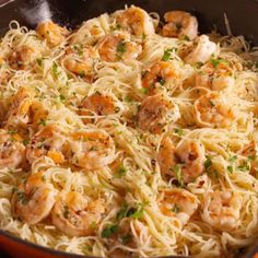 pasta with shrimp and parsley in a skillet